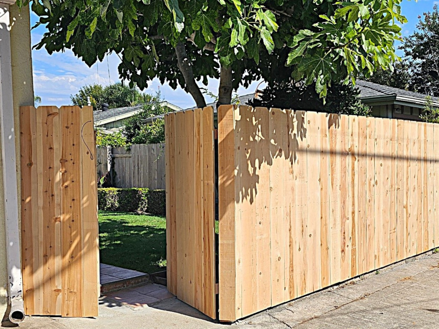 Dog-eared cedar fence by Alpine Fence Company.