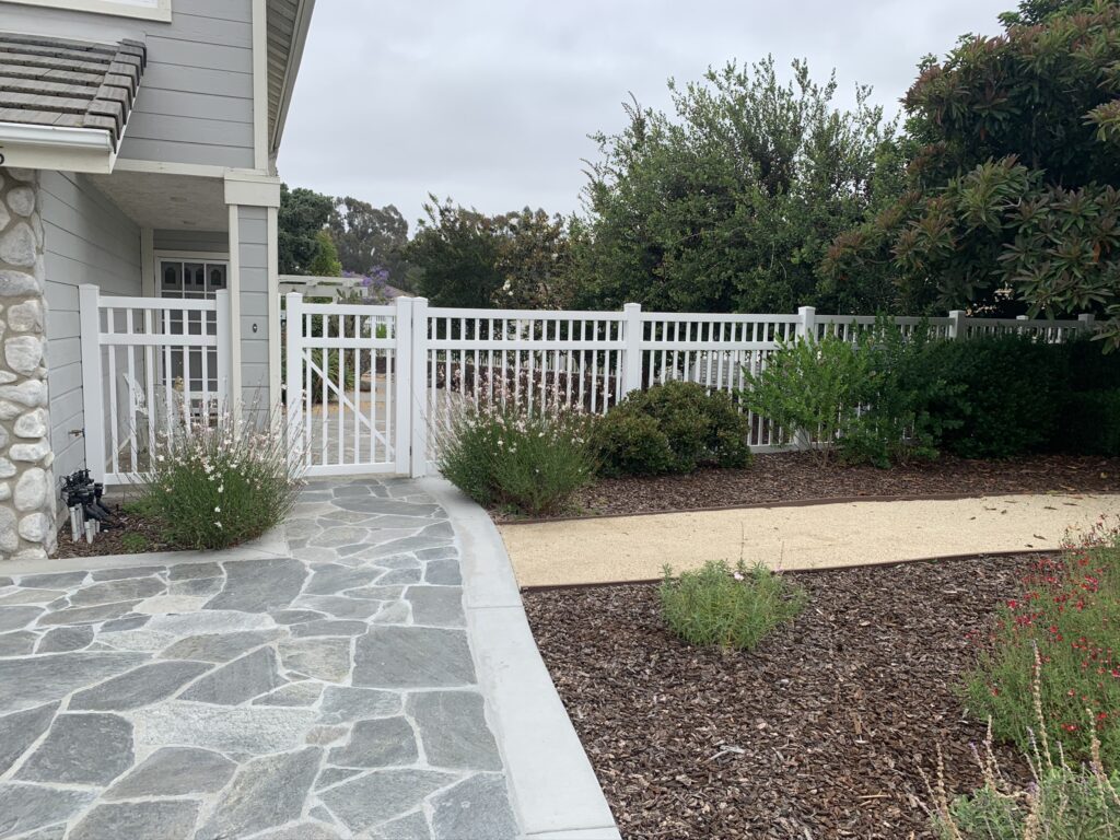 White universal vinyl fence by Alpine Fence Company.