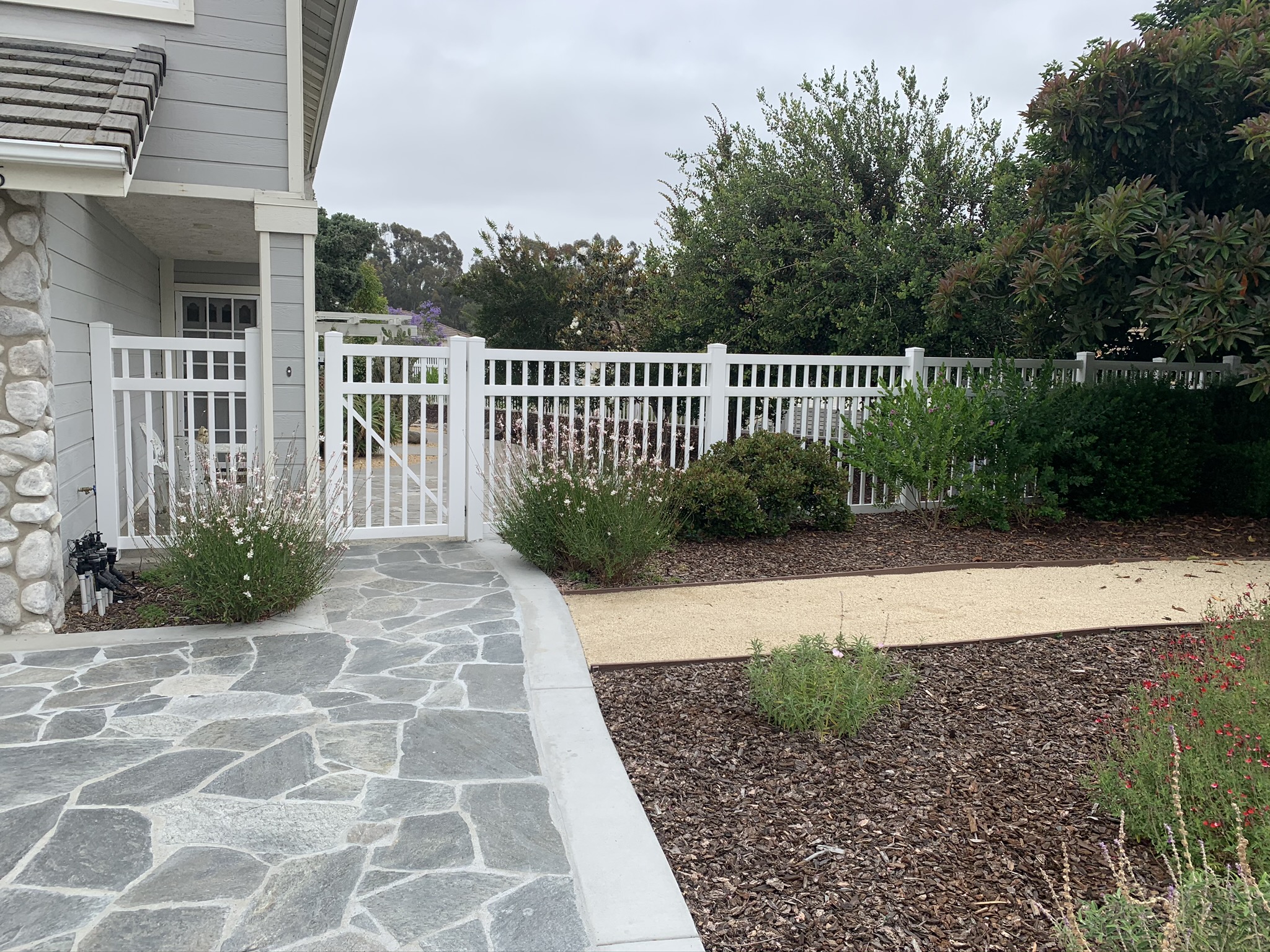 White universal vinyl fence by Alpine Fence Company.