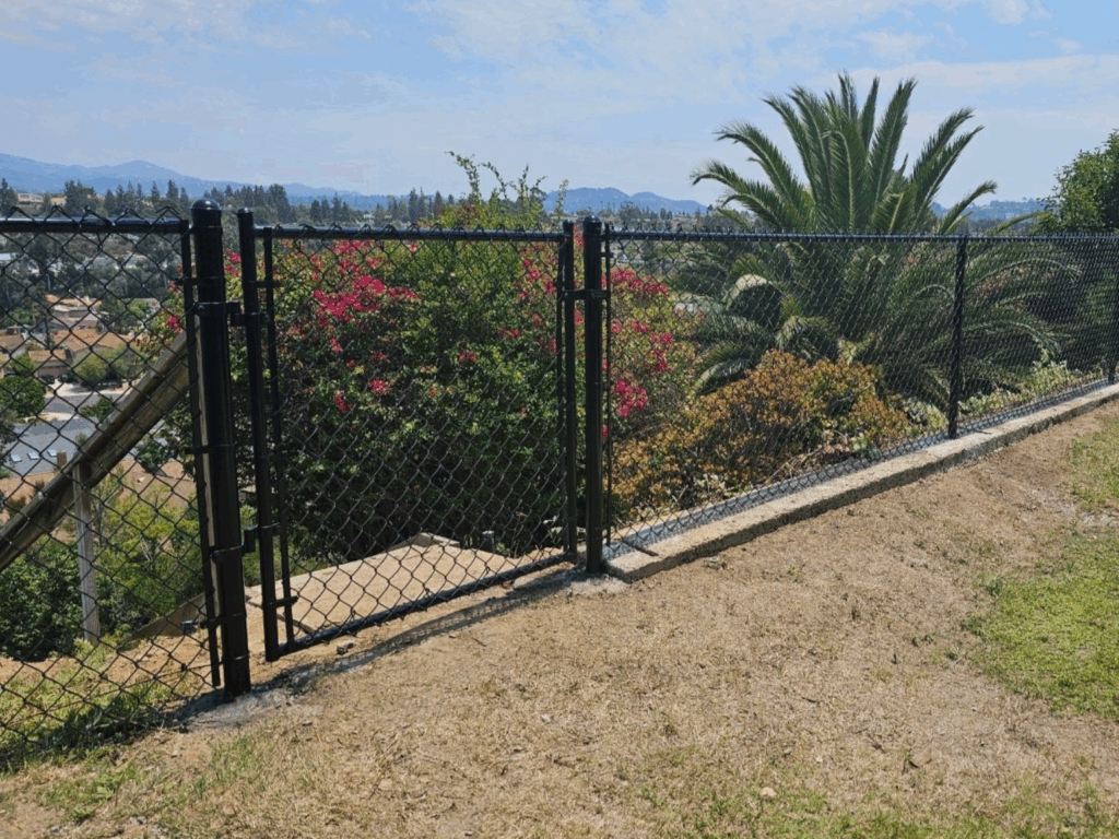 Black chain-link fence by Alpine Fence Company.