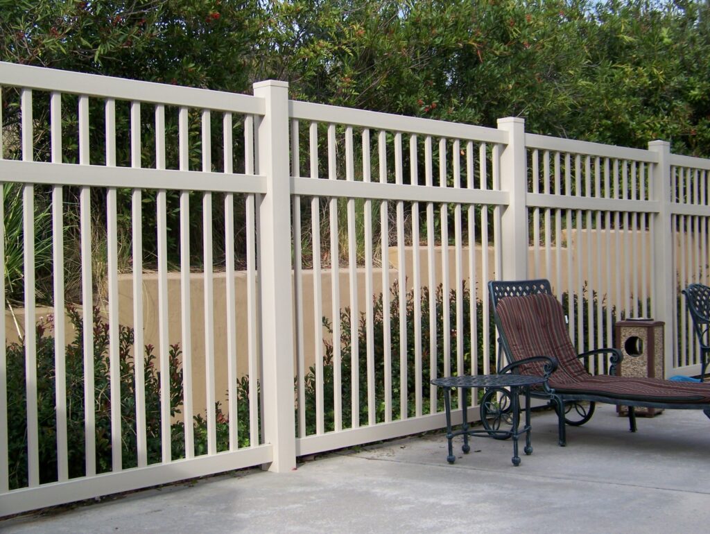 Tan universal vinyl fence by Alpine Fence Company.