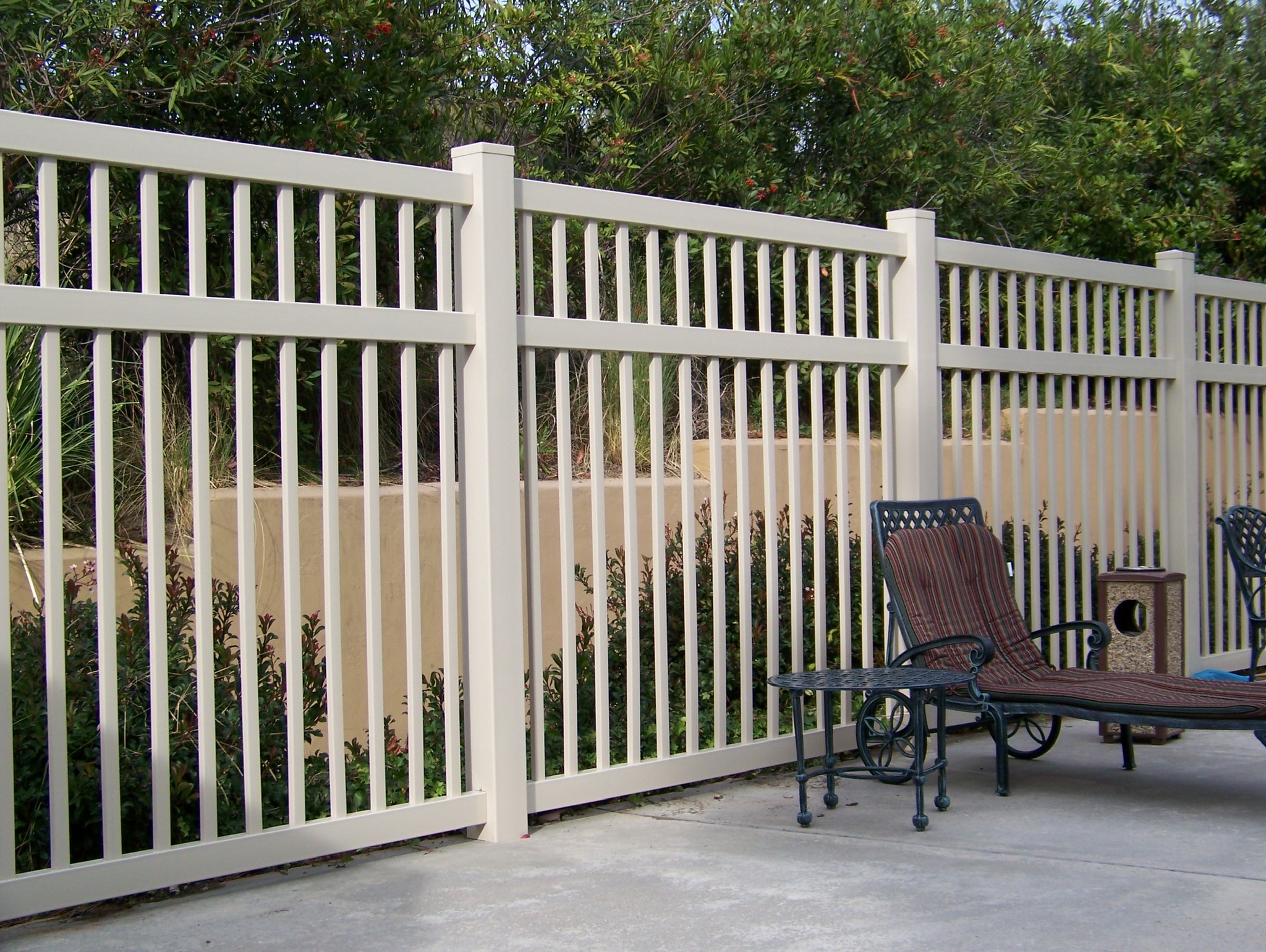 Tan universal vinyl fence by Alpine Fence Company.