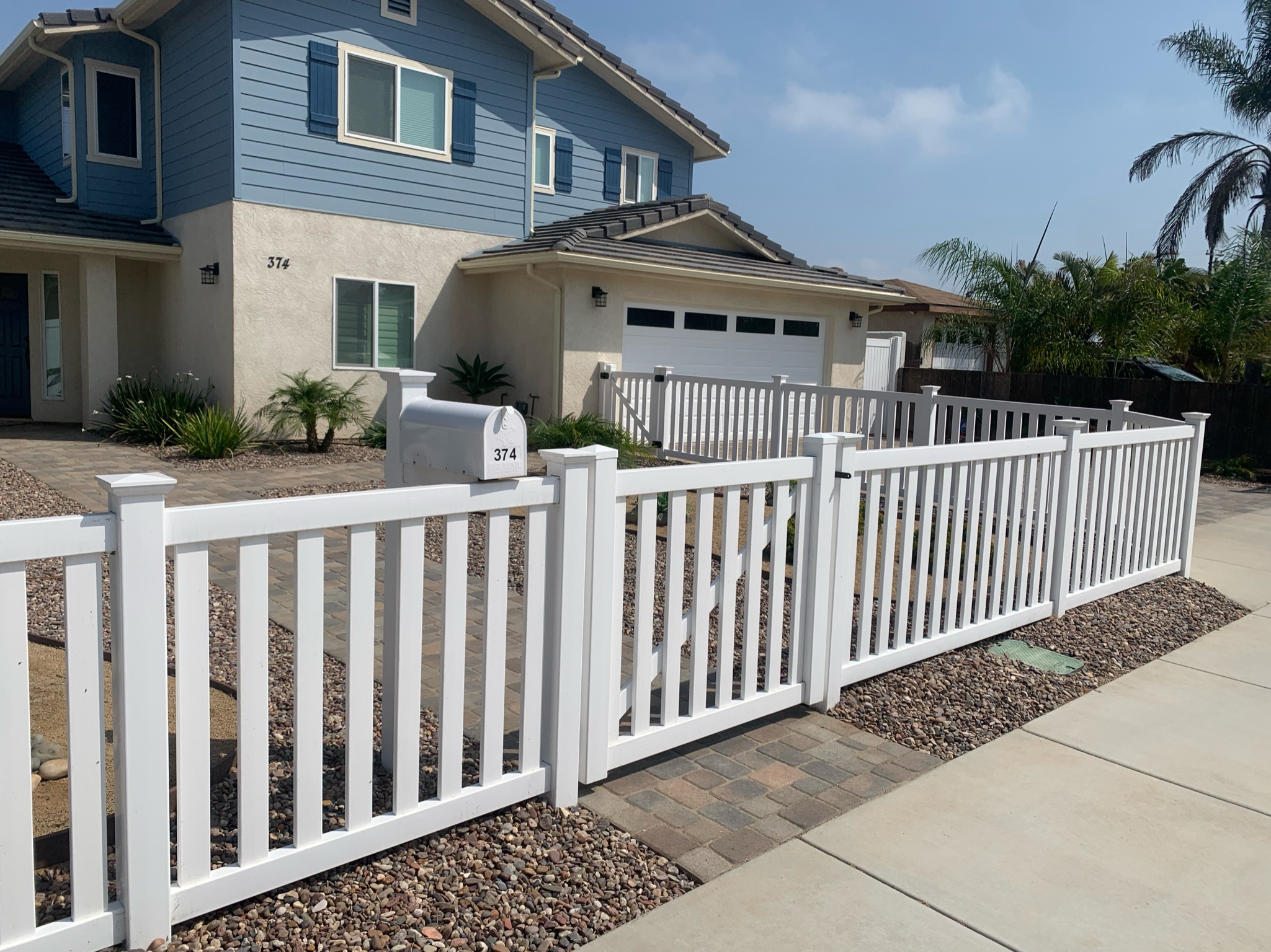 White universal vinyl fence by Alpine Fence Company.