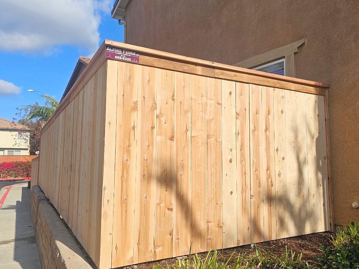 Cedar cap and trim fence by Alpine Fence Company.