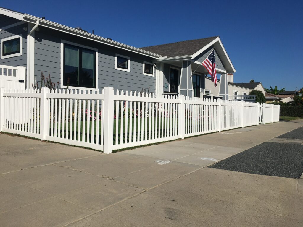 Narrow vinyl picket fence by Alpine Fence Company.