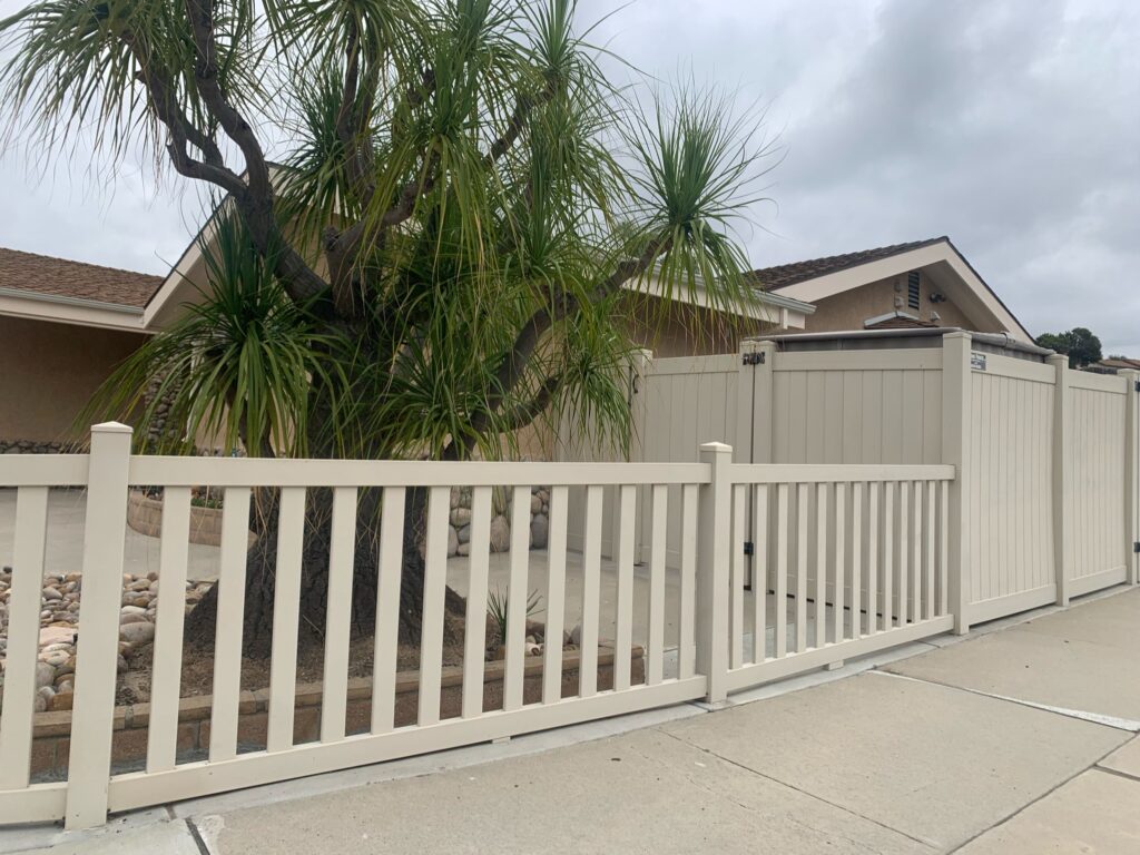 Tan universal vinyl fence by Alpine Fence Company.