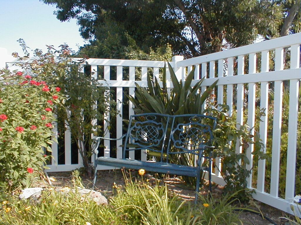 White universal vinyl fence by Alpine Fence Company.