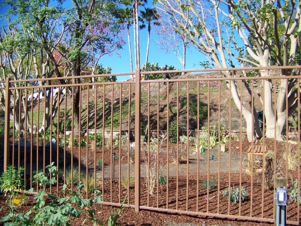 Custom ornamental iron panel design by Alpine Fence Company.