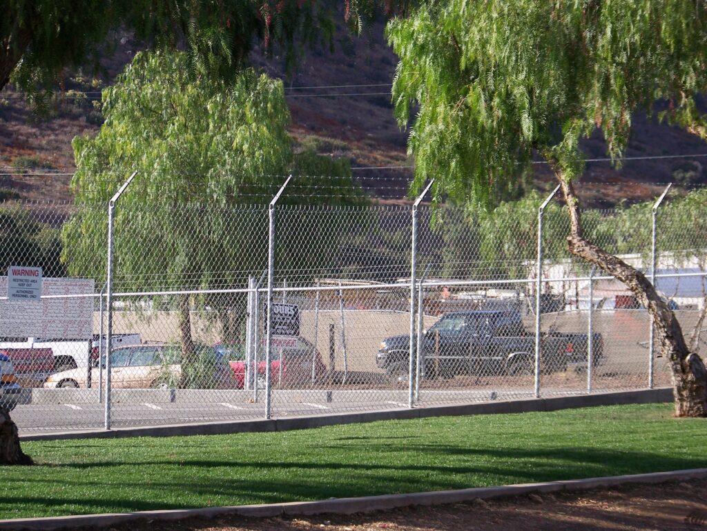 Commercial-grade chain-link fence by Alpine Fence Company.