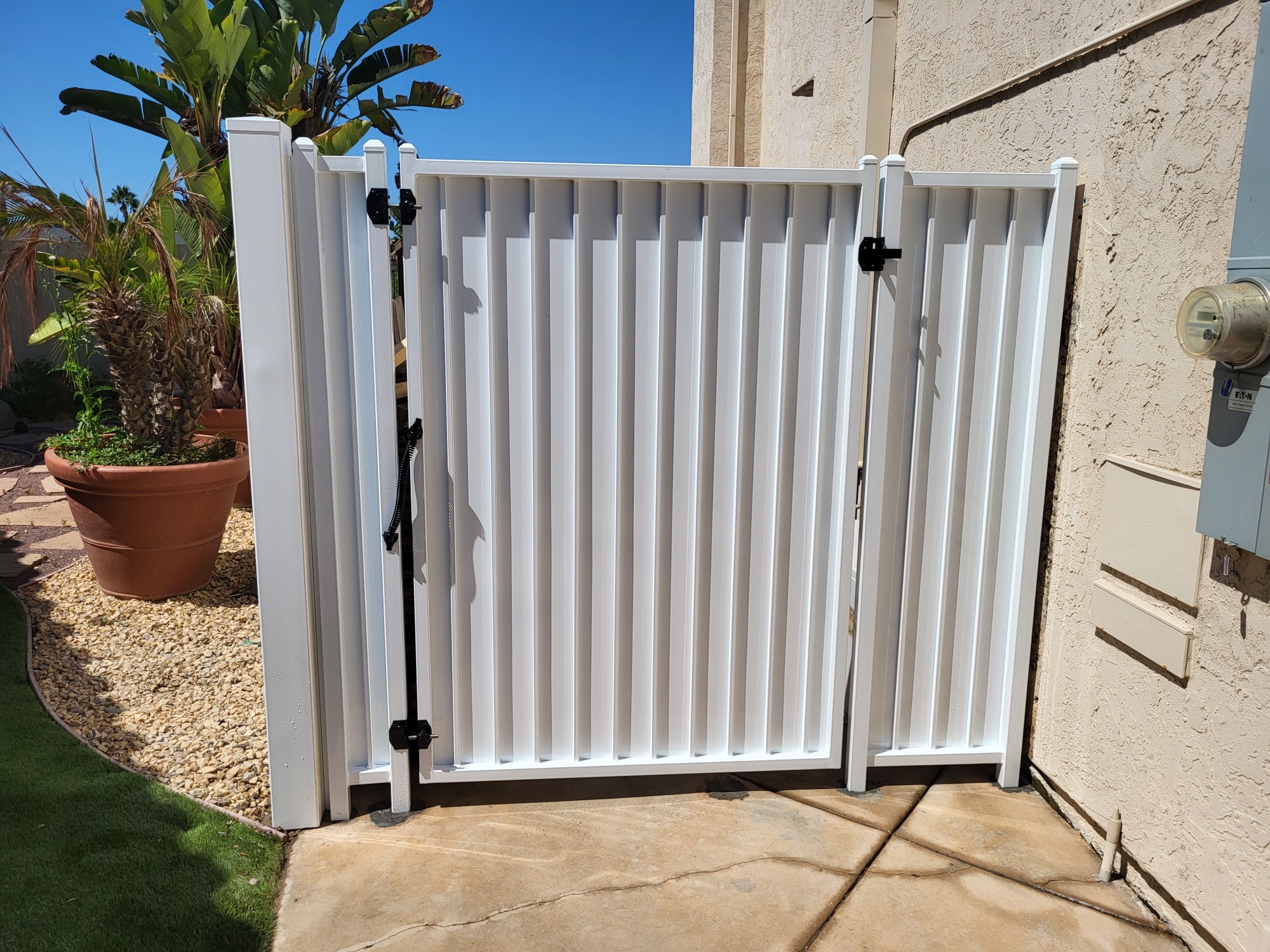 Iron gate with privacy screen by Alpine Fence Company.