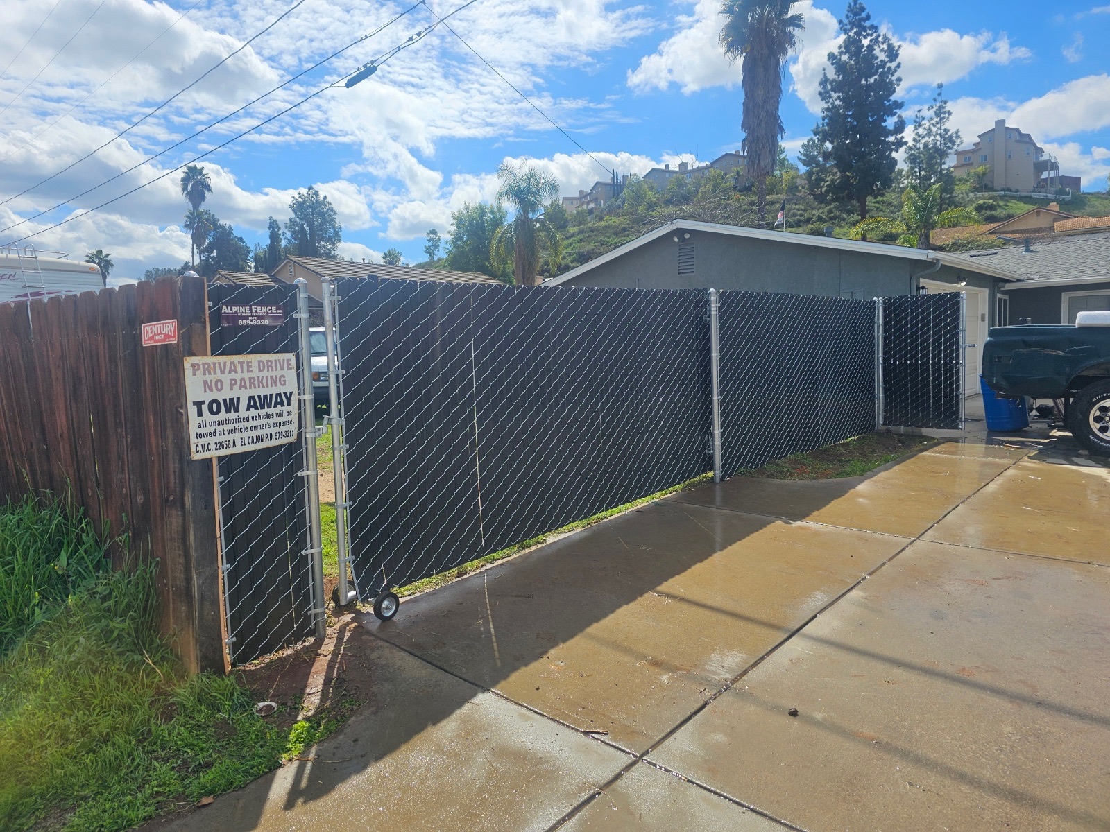 Chain-link slide gate — outside view — by Alpine Fence Company.