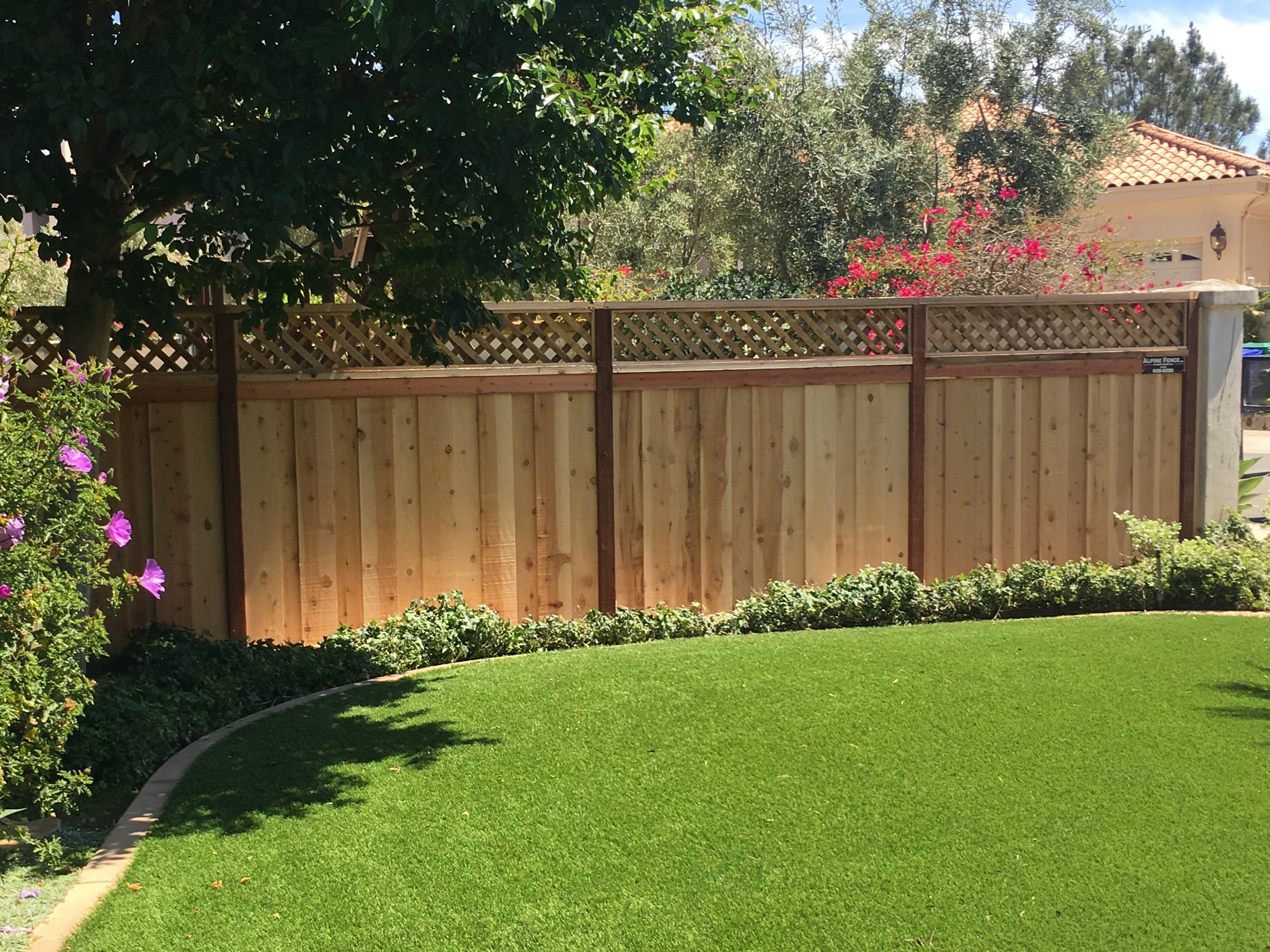 Lattice top on wood fence post by Alpine Fence Company.