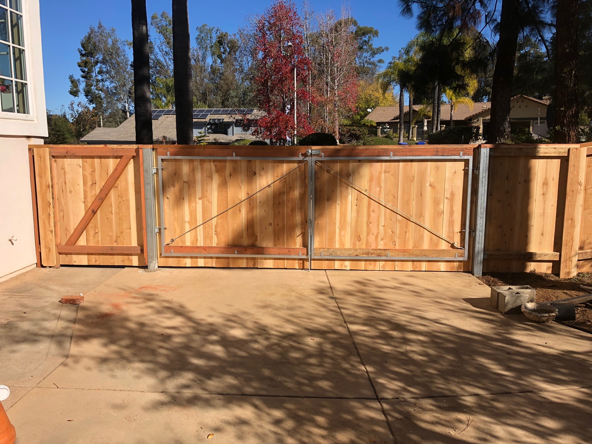 Inside view of a large steel-framed driveway gate by Alpine Fence Company.