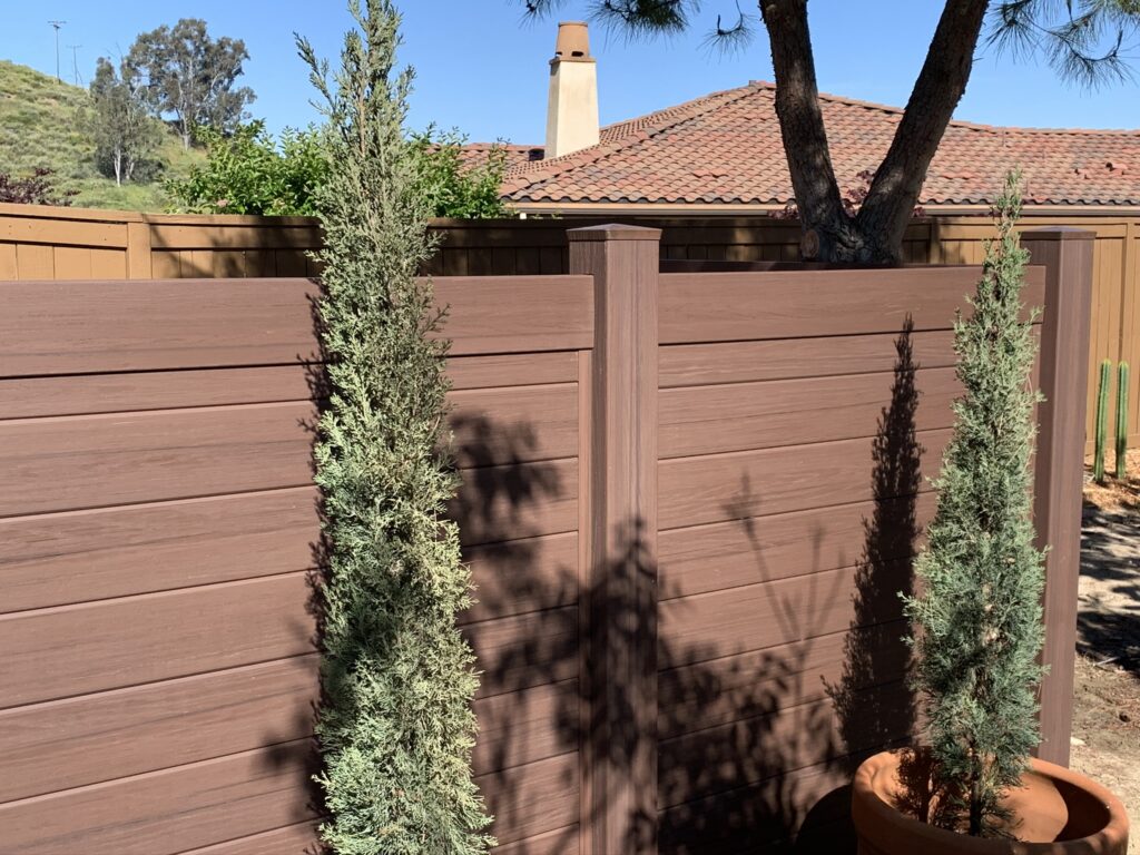 Dark sequoia horizontal vinyl fence by Alpine Fence Company.