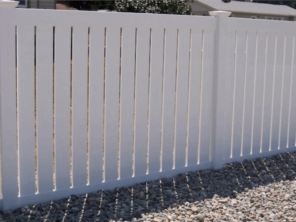Semi-privacy vinyl fence by Alpine Fence Company.