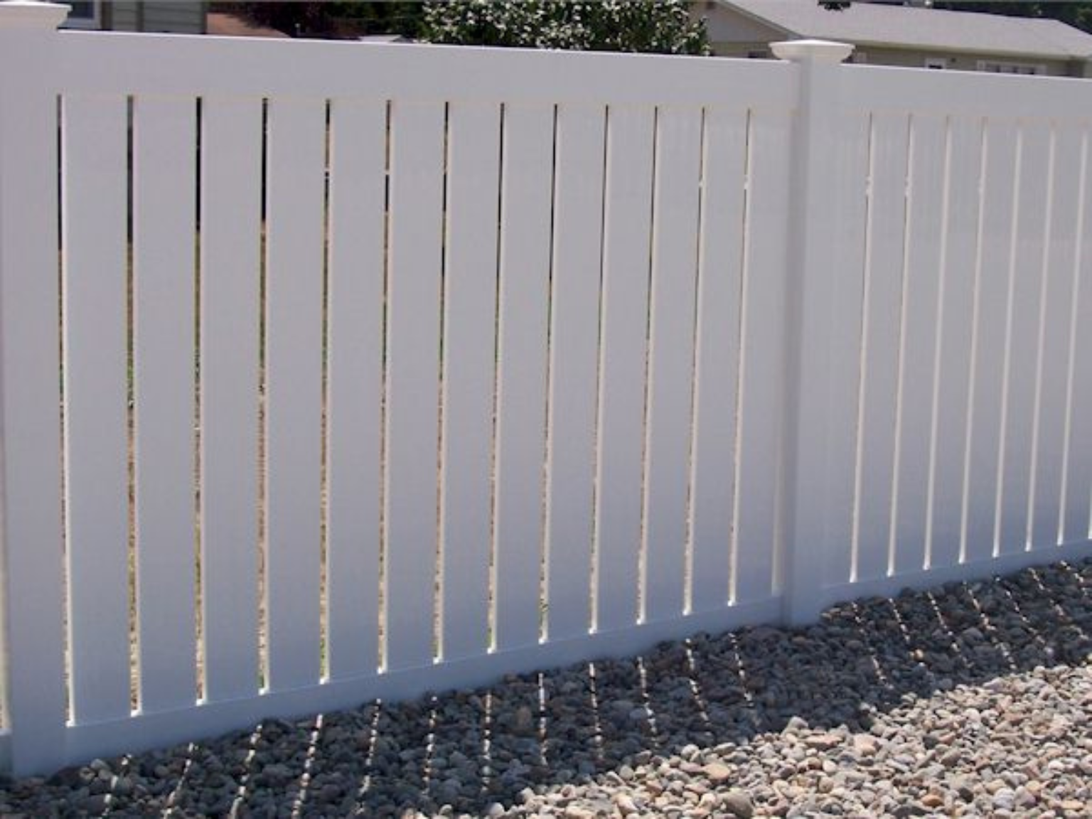 Semi-privacy vinyl fence by Alpine Fence Company.