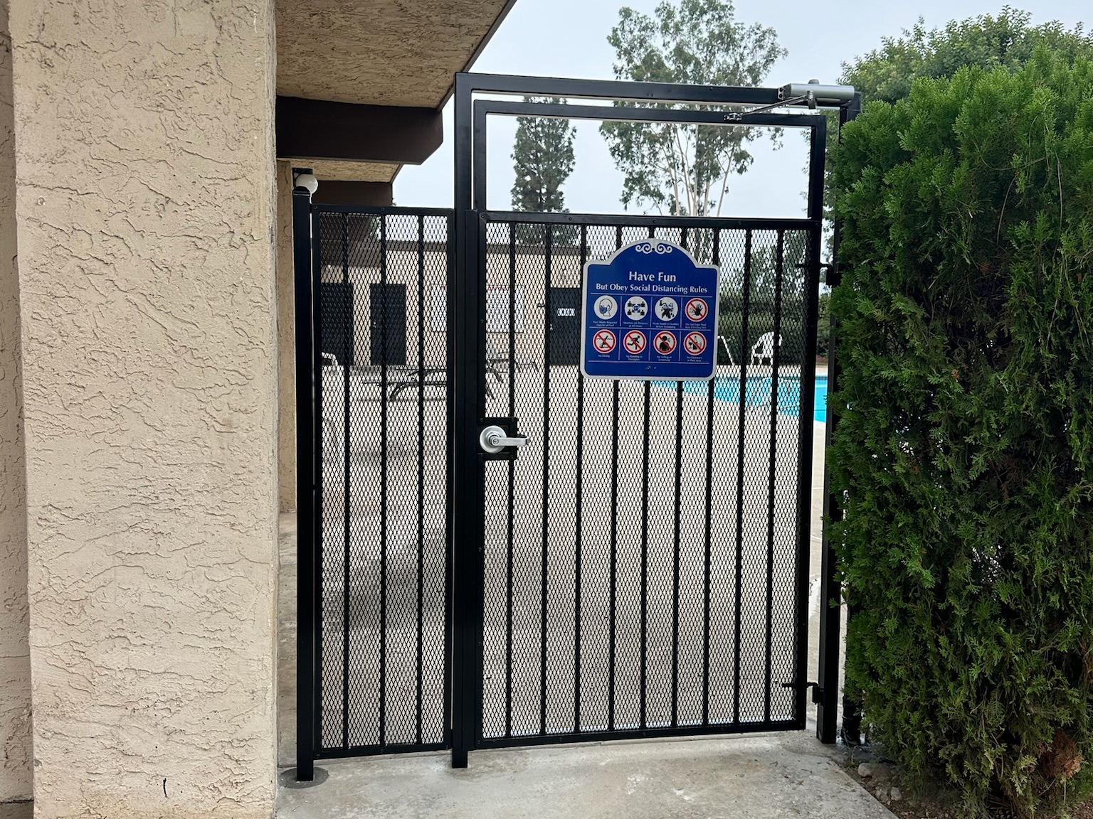 Ornamental iron security gate by Alpine Fence Company.
