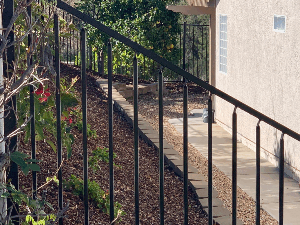 Adjustable iron panel by Alpine Fence Company.