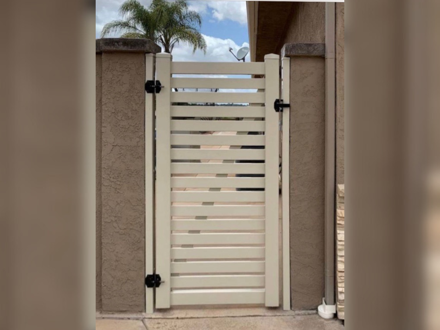 Semi-privacy vinyl gate by Alpine Fence Company.