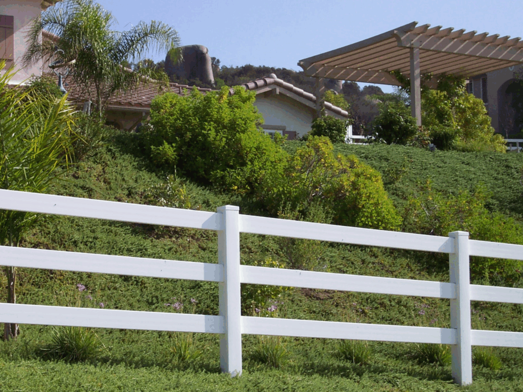 White vinyl ranch rail by Alpine Fence Company.