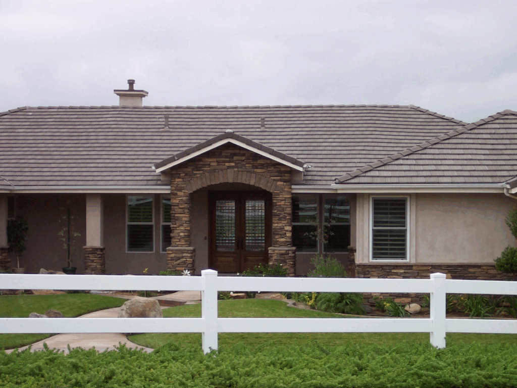 White vinyl ranch rail by Alpine Fence Company.