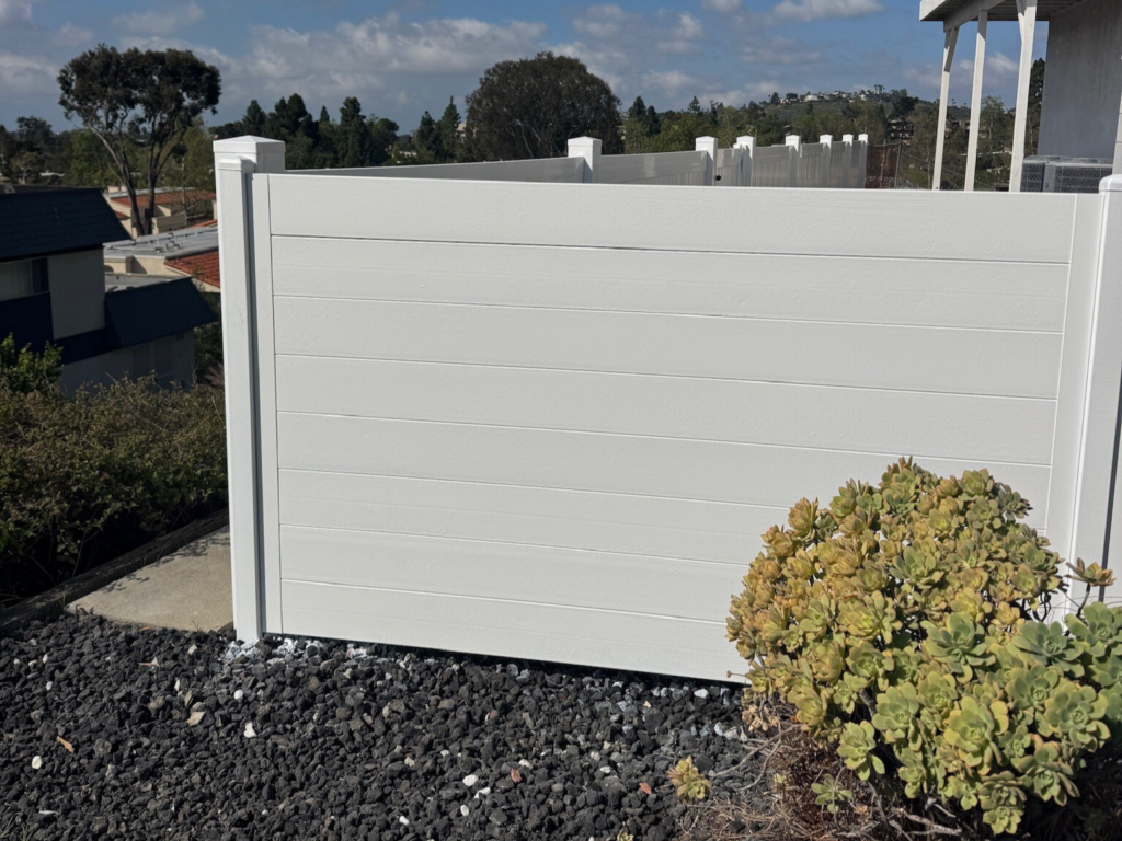 9. White horizontal metal privacy fencing.