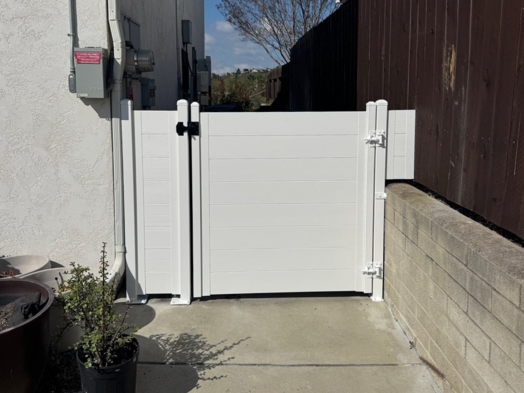 8. Metal horizontal privacy fence with gate.